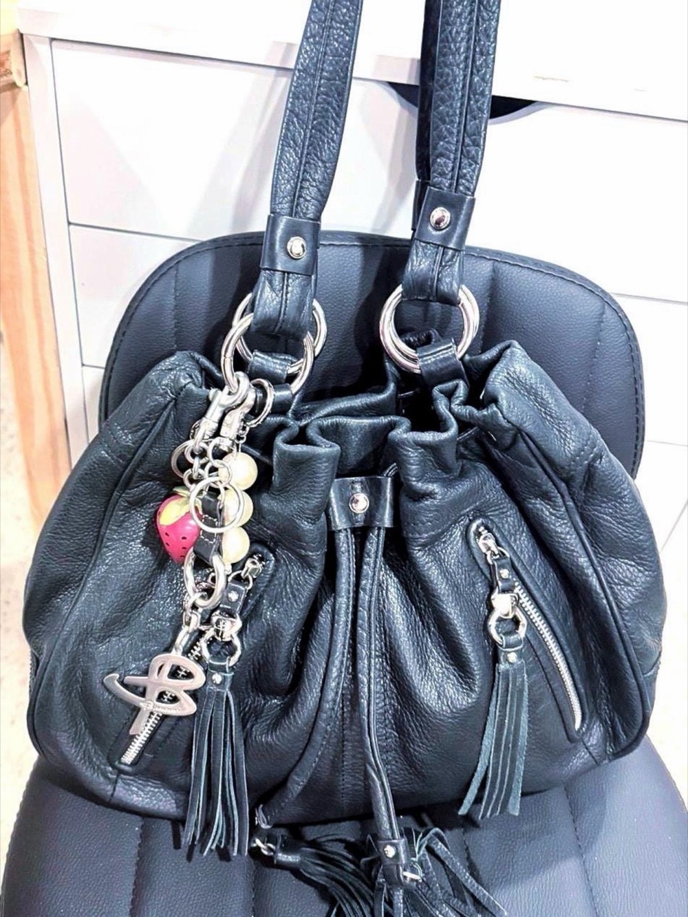 b. makowsky Black Leather Drawstring Shoulder Bag with Tassel and Charm